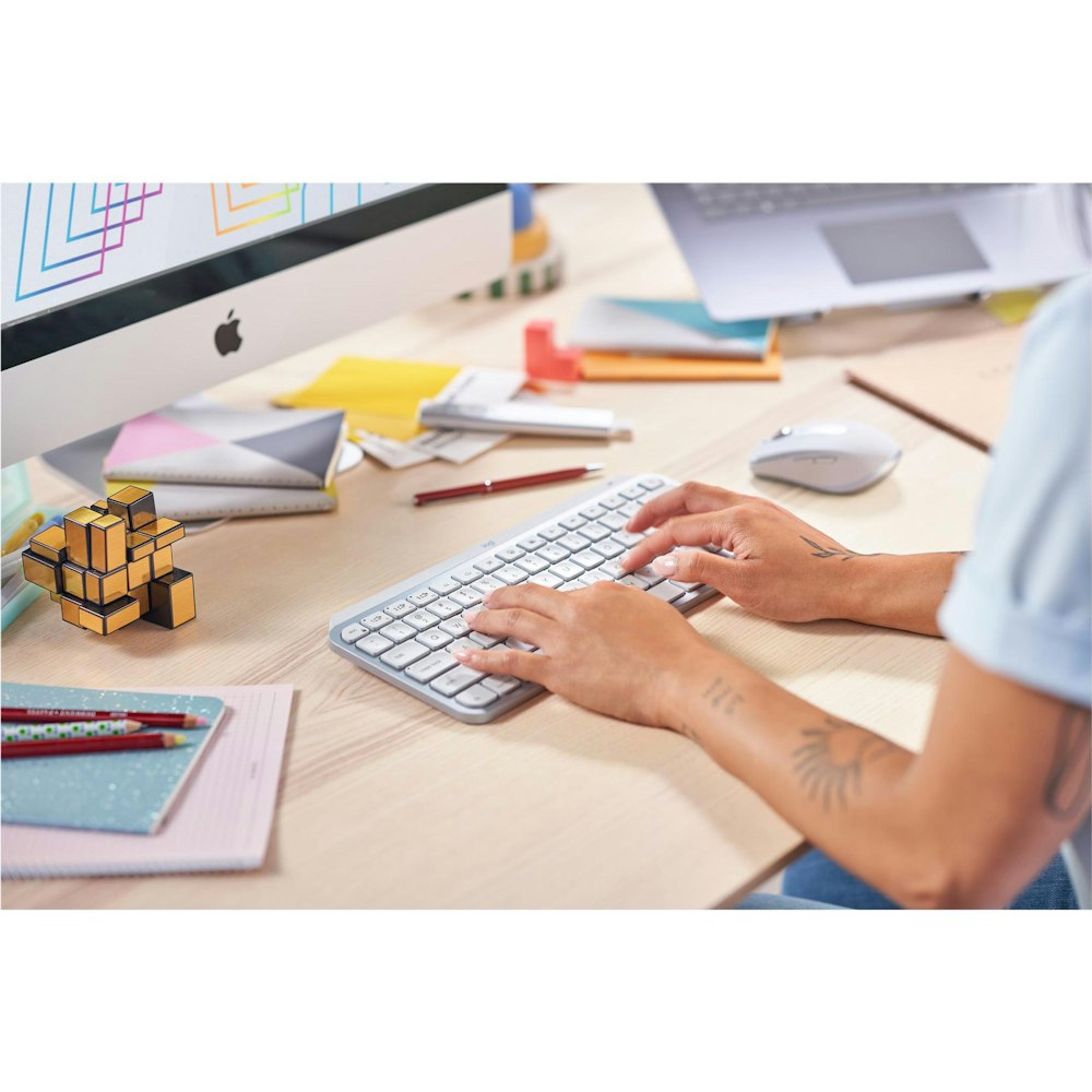 A large main feature product image of Logitech MX Keys Mini Minimalist Wireless Illuminated Keyboard - Pale Grey